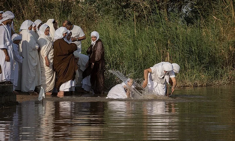 Mandaean priests performing the Masbuta (baptism ritual) in the Karun River, Khuzestan Province, Iran